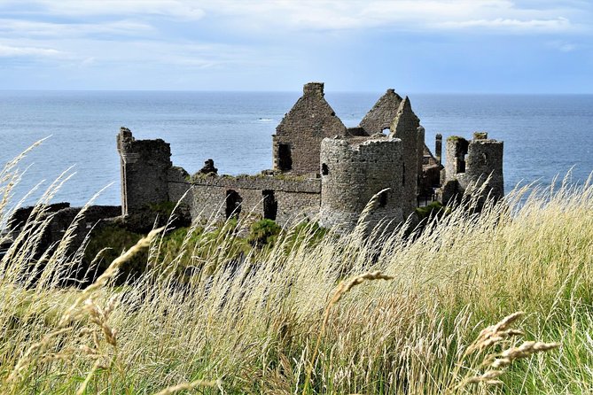 2-Day Northern Ireland Rail Tour: Belfast, Antrim Coast, and Giant's Causeway - Walking toward Carrick-a-Rede Rope Bridge