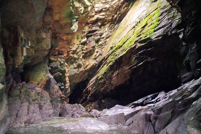 7 Arches Kayak Tour - A private beach and a waterfall inside a cave