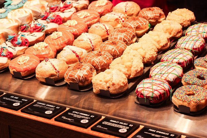 Historic Cork Delicious Donut Adventure by Underground Donut Tour - A rock guitarist on a Cork plaza
