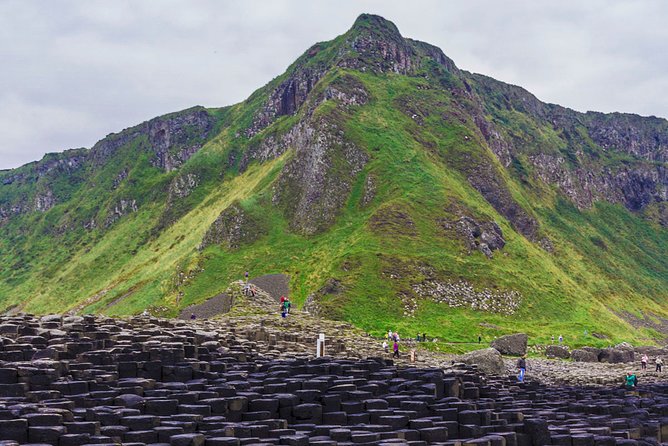 Spanish Belfast And Giants Causeway Tour - Dunluce Castle gives you a quick coastal preview